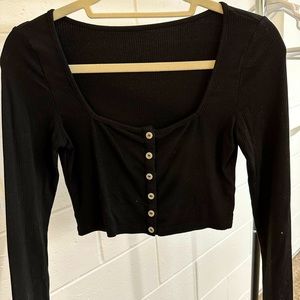 black ribbed long sleeve crop top with button-front